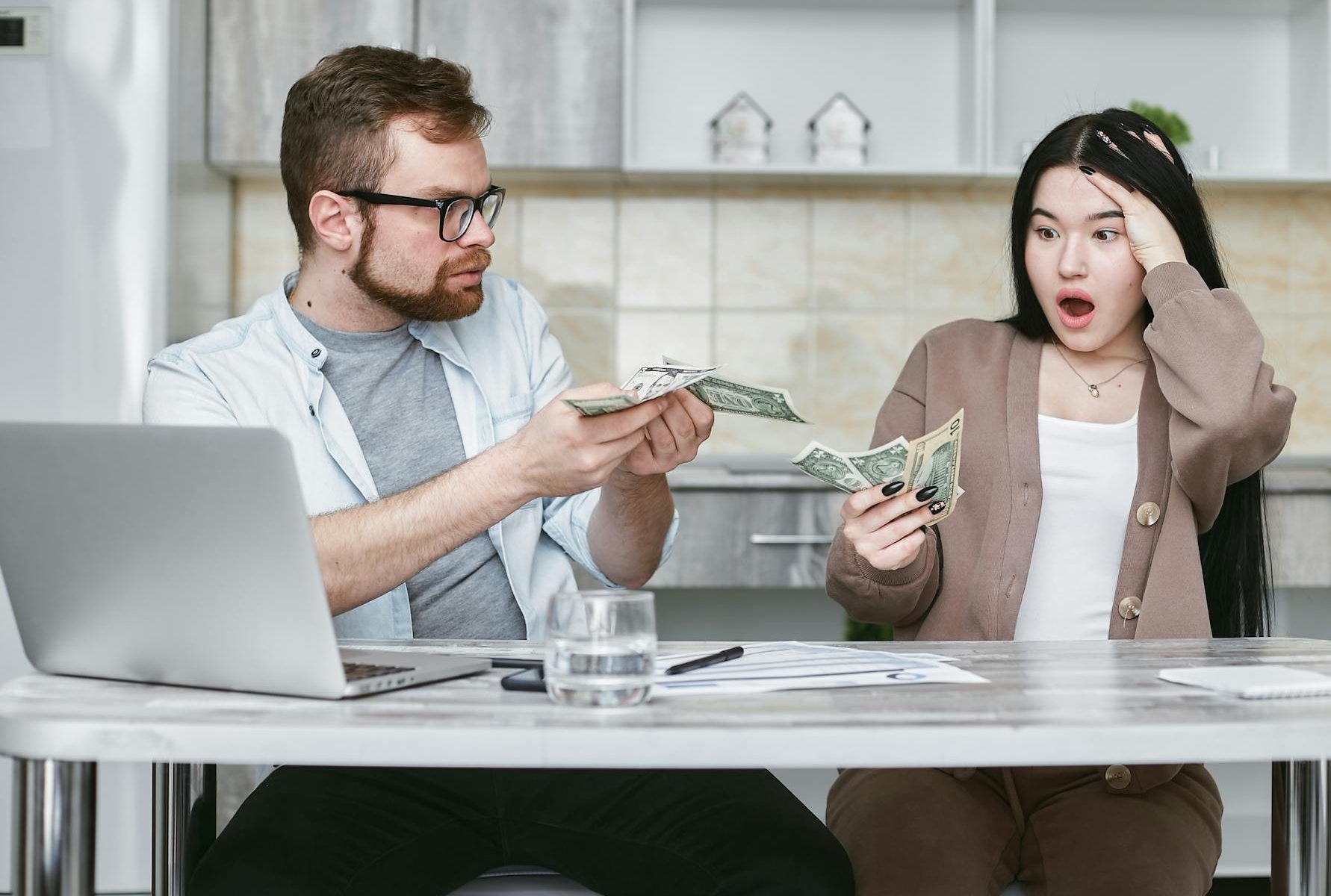 man and woman sitting at the table